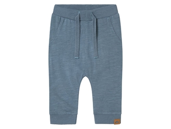 Name It trousers celestial blue with dinosaurs