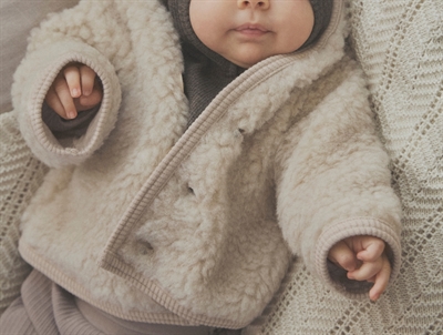 Huttelihut wool jacket cement with pointed hood and pom-pom