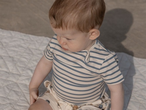Petit Piao bodysuit with blue mirage stripes  